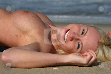 To use this stock image in your creative project, please select the size you need over to the right and click the "Add to Cart" button.
Your downloaded image will come with the Cutcaster watermark removed so don’t worry about the watermark you see on this page. Down The Shore - #1 Right stock photo, Topless beauty relaxes on a beach (gunnison beach NJ) By the Water Face right (see also Face left) by Gregg Cerenzio