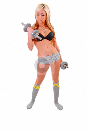 To use this stock image in your creative project, please select the size you need over to the right and click the "Add to Cart" button.
Your downloaded image will come with the Cutcaster watermark removed so don’t worry about the watermark you see on this page. Young woman exercising. stock photo, A young pretty woman in gray shorts and socks and black bra exercising
with dumbbells for white background in the studio. by Horst Petzold