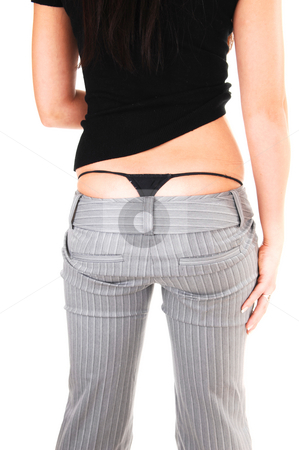 To use this stock image in your creative project, please select the size you need over to the right and click the "Add to Cart" button.
Your downloaded image will come with the Cutcaster watermark removed so don’t worry about the watermark you see on this page. The back and thong of woman. stock photo, The back of an young woman in a gray dress pants and black sweater
shooing her black thong underwear, for white background. by Horst Petzold