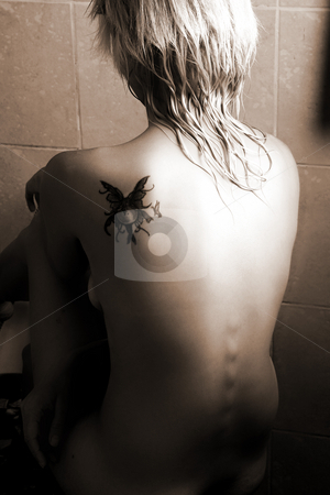 To use this stock image in your creative project, please select the size you need over to the right and click the "Add to Cart" button.
Your downloaded image will come with the Cutcaster watermark removed so don’t worry about the watermark you see on this page. Woman #26 stock photo, Nude woman in a bathroom. Black and white. Sepia tone. by Sean Nel