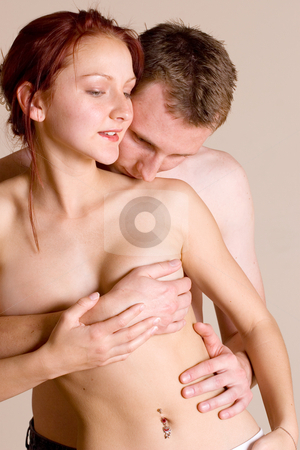 To use this stock image in your creative project, please select the size you need over to the right and click the "Add to Cart" button.
Your downloaded image will come with the Cutcaster watermark removed so don’t worry about the watermark you see on this page. Couple #37 stock photo, Woman in front of boyfriend - breasts covered by Sean Nel